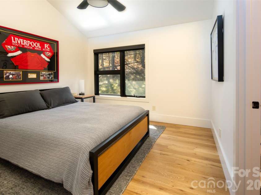42 Spring Cove Road, Asheville, NC 28804.  MLS# CAR4246585, YatesRealty ID 29948. Bedroom has ensuite bathroom access.