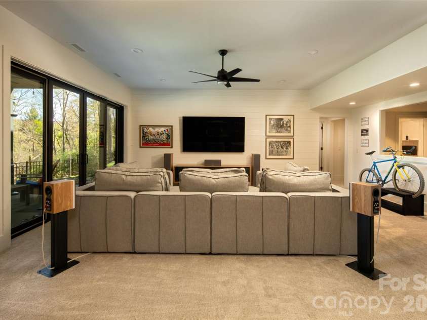 42 Spring Cove Road, Asheville, NC 28804.  MLS# CAR4246585, YatesRealty ID 29948. Family room also opens to outdoor covered porch. 