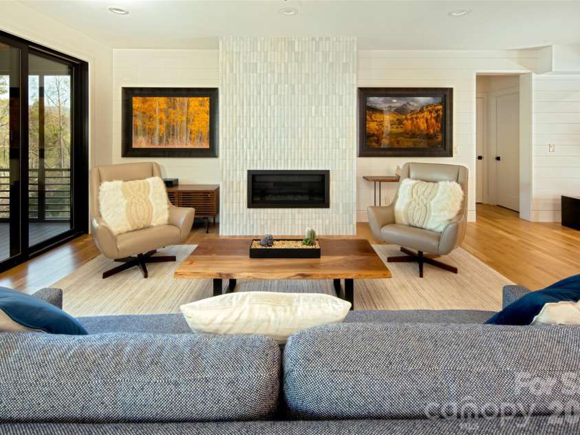 42 Spring Cove Road, Asheville, NC 28804.  MLS# CAR4246585, YatesRealty ID 29948. Floor to ceiling gas fireplace with custom tile surround. Nickel gap walls throughout main level living room spaces.
