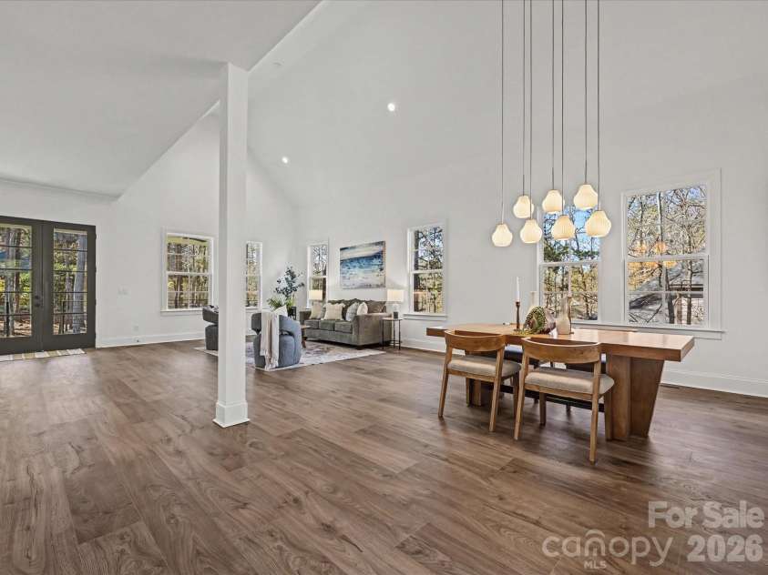 4609 Firethorn Court, Denver, NC 28037.  MLS# CAR4358984, YatesRealty ID 29951. Light-filled great room and dining area with soaring ceilings, expansive windows, and an open-concept layout perfect for entertaining and everyday living.