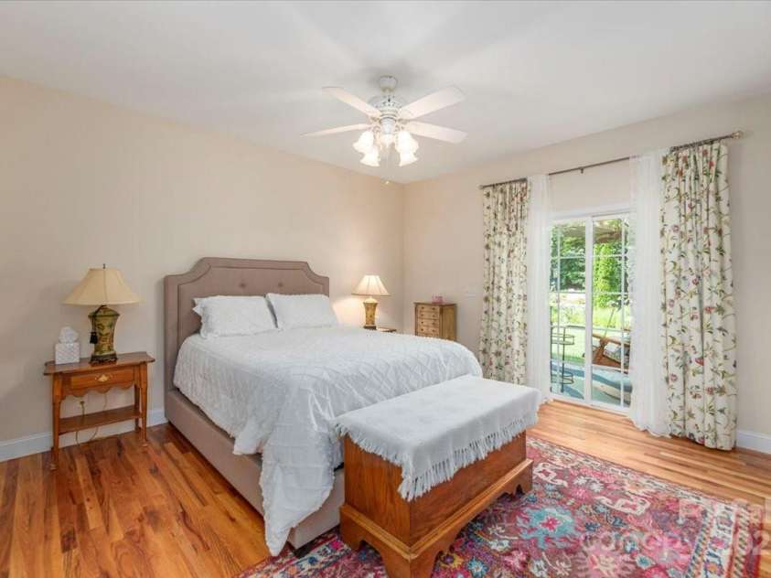 116 Dolata Lane, Waynesville, NC 28786.  MLS# CAR4281264, YatesRealty ID 29956. Primary bedroom, with sliders to deck