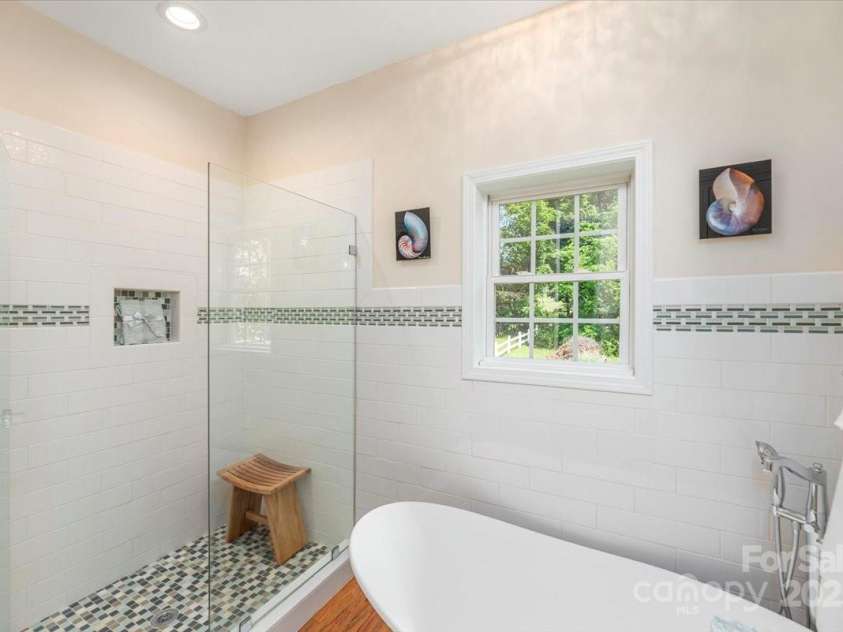 116 Dolata Lane, Waynesville, NC 28786.  MLS# CAR4281264, YatesRealty ID 29956. Soaking tub and walk in shower