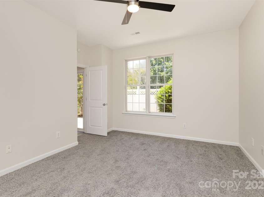 8390 Chaceview Court, Charlotte, NC 28269.  MLS# CAR4283871, YatesRealty ID 29962. Main level primary bedroom