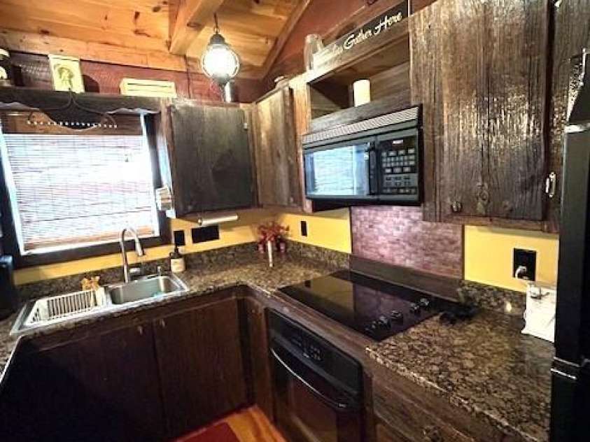 116 Minerva Lane, Sapphire, NC 28774.  MLS# CAR4237813, YatesRealty ID 2997. Custom barnwood cabinetry