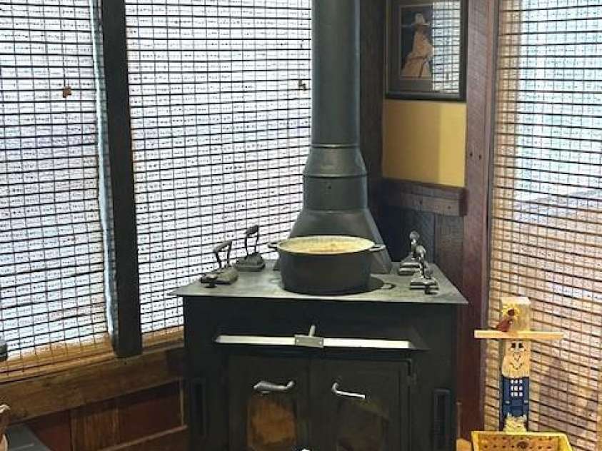 116 Minerva Lane, Sapphire, NC 28774.  MLS# CAR4237813, YatesRealty ID 2997. Woodstove in den