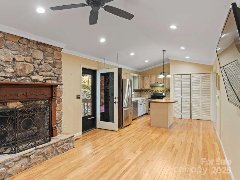 6 Wilderness Cove Road, Asheville, NC 28804.  MLS# CAR4274846, YatesRealty ID 29979. High ceilings marry the gas log living space and the kitchen.