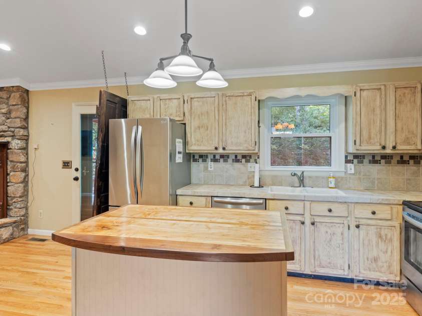 6 Wilderness Cove Road, Asheville, NC 28804.  MLS# CAR4274846, YatesRealty ID 29979. Kitchen leads to the back porch for easy access.