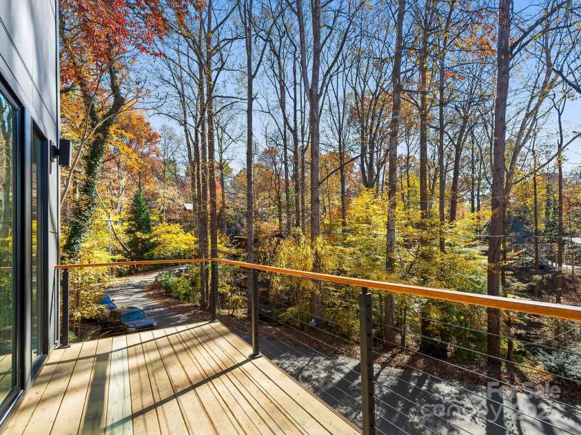 15 Perdue Place, Asheville, NC 28806.  MLS# CAR4316954, YatesRealty ID 2998. Balcony deck in the trees
