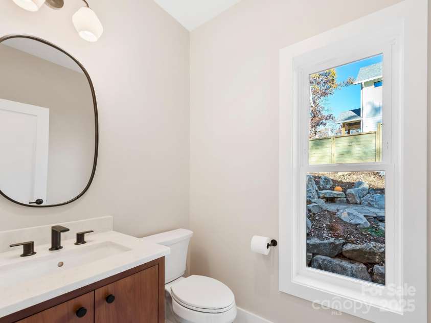 15 Perdue Place, Asheville, NC 28806.  MLS# CAR4316954, YatesRealty ID 2998. Main level powder room