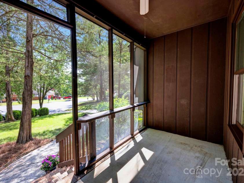 7904 Deep Hollow Court, Charlotte, NC 28226.  MLS# CAR4286796, YatesRealty ID 29980. Screened in front porch