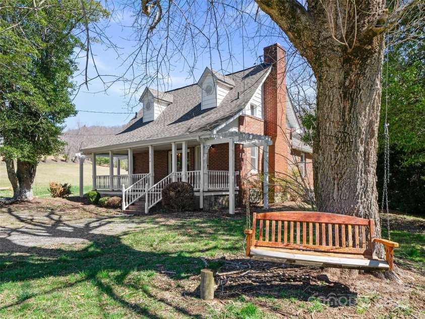 384 Flat Creek Road, Fairview, NC 28730.  MLS# CAR4240696, YatesRealty ID 2999. 1920 Brick farmhouse