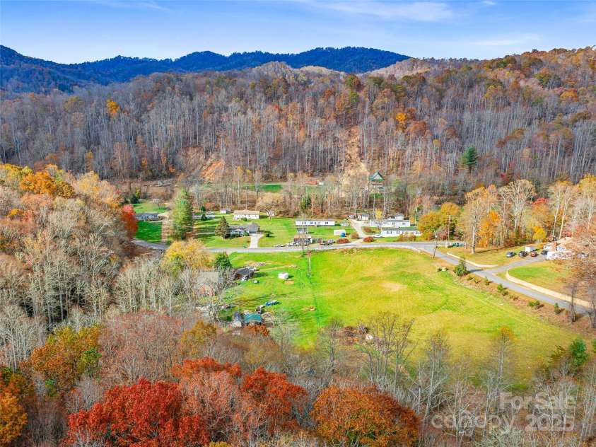 384 Flat Creek Road, Fairview, NC 28730.  MLS# CAR4240696, YatesRealty ID 2999. Drone view in the fall looking toward Garren Crk valley