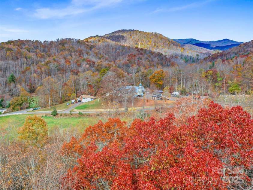 384 Flat Creek Road, Fairview, NC 28730.  MLS# CAR4240696, YatesRealty ID 2999. Drone view of Nesbitt Chapel from back of property.