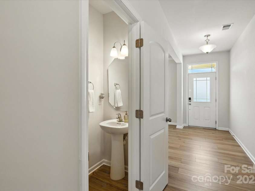 3304 Cheyney Park Drive, Charlotte, NC 28269.  MLS# CAR4279743, YatesRealty ID 29990. Powder Room peek through