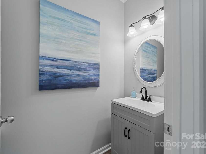 929 Central Park Circle, Davidson, NC 28036.  MLS# CAR4283985, YatesRealty ID 29992. Powder room off the living room