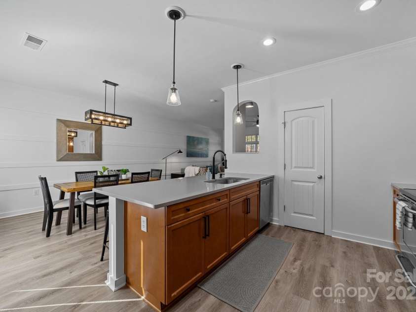 929 Central Park Circle, Davidson, NC 28036.  MLS# CAR4283985, YatesRealty ID 29992. Quartz countertops and black hardware throughout the kitchen