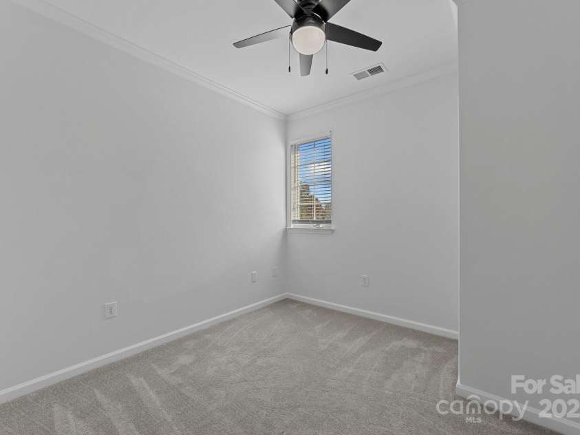 929 Central Park Circle, Davidson, NC 28036.  MLS# CAR4283985, YatesRealty ID 29992. Secondary bedroom upstairs at the back of the home