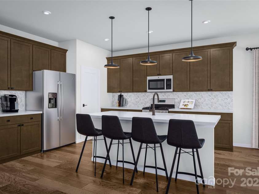 8237 Franklin Trail Street, Mint Hill, NC 28227.  MLS# CAR4287473, YatesRealty ID 29996. Illustration of open kitchen concept with quartz countertops and custom cabinetry.