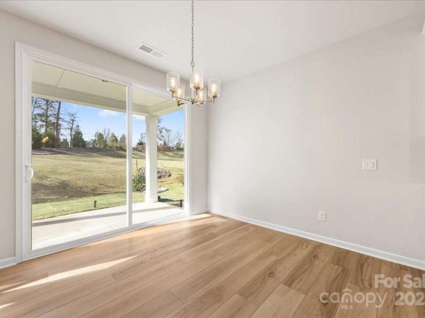 8237 Franklin Trail Street, Mint Hill, NC 28227.  MLS# CAR4318996, YatesRealty ID 29996. Dining Space Featuring Large Sliding Glass Doors to Outdoor Living.