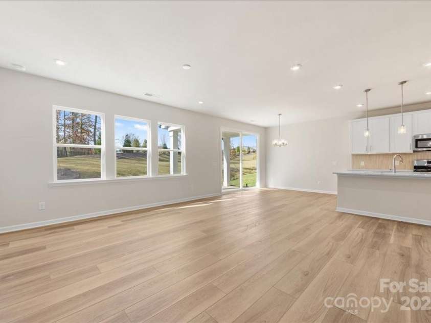 8237 Franklin Trail Street, Mint Hill, NC 28227.  MLS# CAR4318996, YatesRealty ID 29996. From Great Room to Kitchen These Spaces are Beautifully Blended.