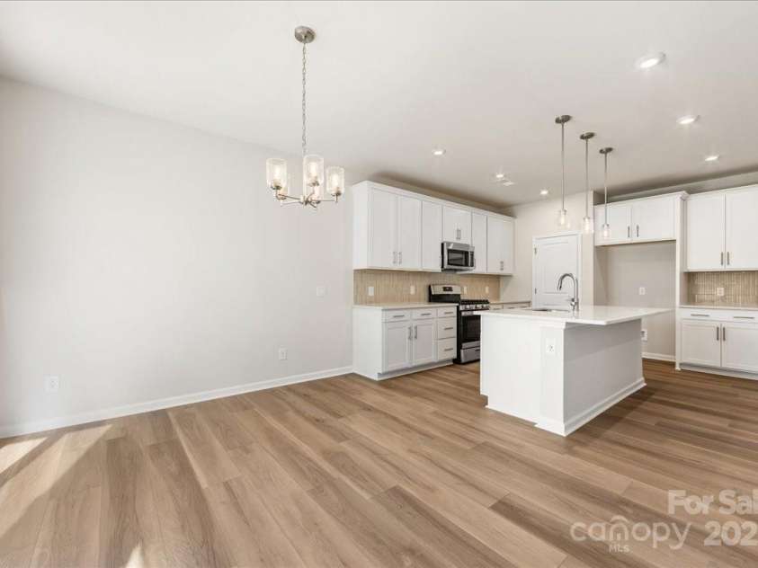 8237 Franklin Trail Street, Mint Hill, NC 28227.  MLS# CAR4331815, YatesRealty ID 29996. Dining and Kitchen Seamlessly Connected.