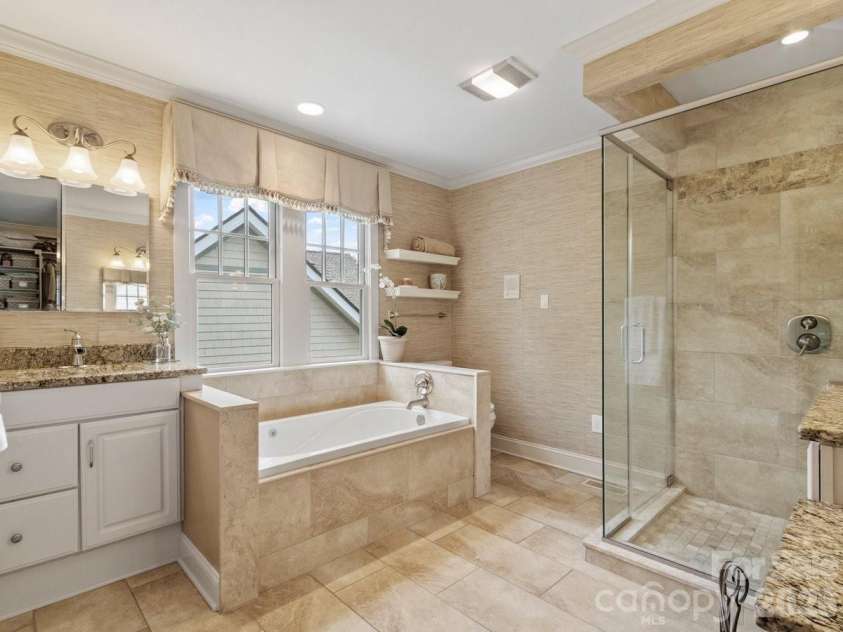 6 Creekside Way, Asheville, NC 28804.  MLS# CAR4379945, YatesRealty ID 29998. Primary bath, double sinks.