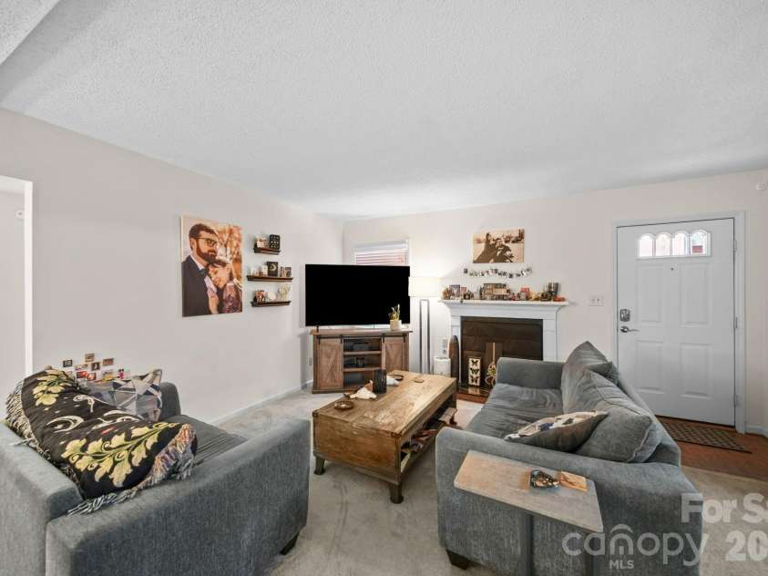 6049 Green Forest Drive, Charlotte, NC 28212.  MLS# CAR4391912, YatesRealty ID 30018. Front door/ Living room