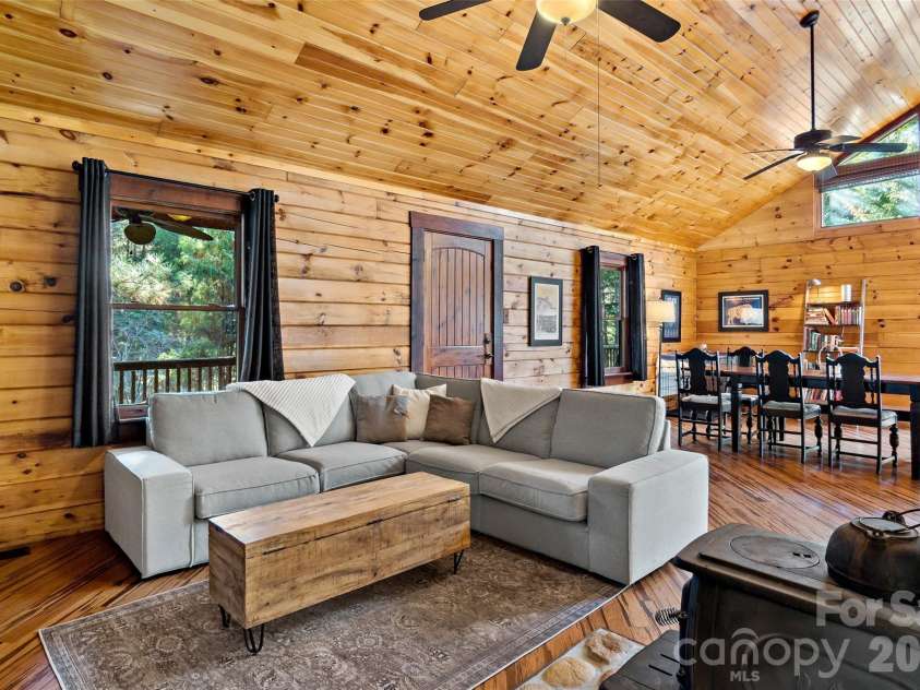 317 Chocolate Drop Circle, Union Mills, NC 28167.  MLS# CAR4337126, YatesRealty ID 3002. Living area with wood stove