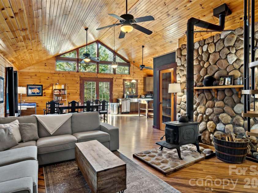 317 Chocolate Drop Circle, Union Mills, NC 28167.  MLS# CAR4337126, YatesRealty ID 3002. Living area with wood stove