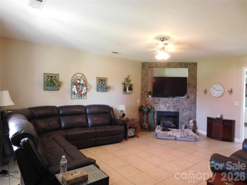 5402 Griffith Road, Monroe, NC 28112.  MLS# CAR4387389, YatesRealty ID 30020. Living room w/fireplace