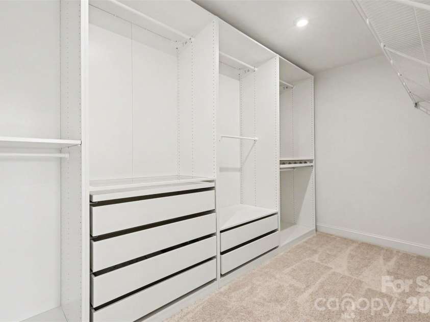 14125 Glaswick Drive, Charlotte, NC 28278.  MLS# CAR4400797, YatesRealty ID 30033. Primary Bedroom Walk In Closet with Custom Storage System.