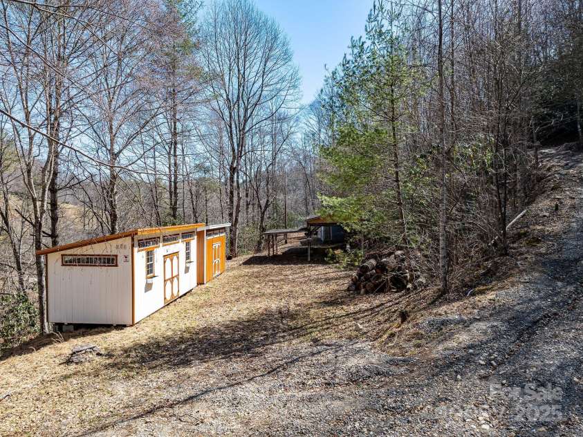 177 Bradford Road, Burnsville, NC 28714.  MLS# CAR4233319, YatesRealty ID 30036. 2 brand new sheds and  40' RV carport.