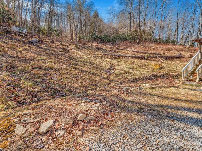177 Bradford Road, Burnsville, NC 28714.  MLS# CAR4233319, YatesRealty ID 30036. Natural spring runs along driveway