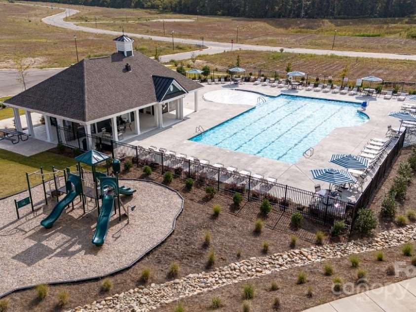 525 Jacobus Lane, Monroe, NC 28112.  MLS# CAR4284962, YatesRealty ID 30037. Playground next to the pool