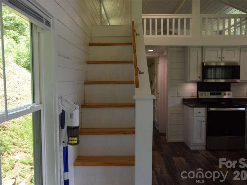 619 Kitchens Branch Road, Sylva, NC 28779.  MLS# CAR4386073, YatesRealty ID 30047. Stairs to loft