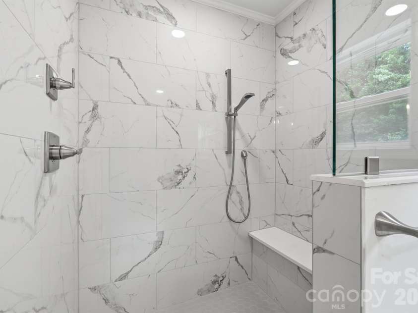 7553 Katherine Drive, Denver, NC 28037.  MLS# CAR4389054, YatesRealty ID 30052. Luxury full tile shower with bench and multiple shower heads