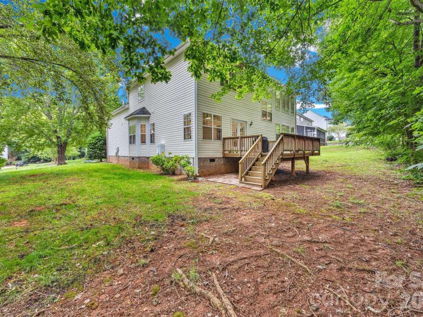 171 Longboat Road, Mooresville, NC 28117.  MLS# CAR4391201, YatesRealty ID 30056. Back Deck and side yard