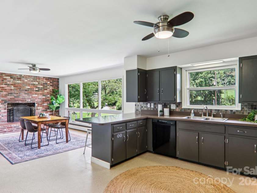 324 Old Leicester Highway, Asheville, NC 28806.  MLS# CAR4223880, YatesRealty ID 30073. Kitchen > Dining + Fireplace