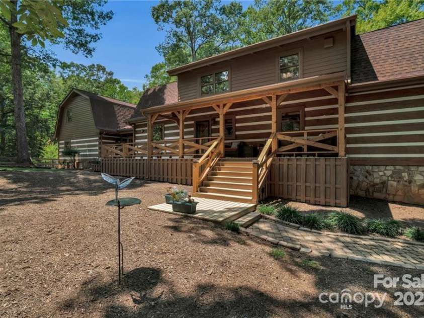 2709 Blythe Road, Waxhaw, NC 28173.  MLS# CAR4264770, YatesRealty ID 30075. Covered porch overlooking this massive backyard.