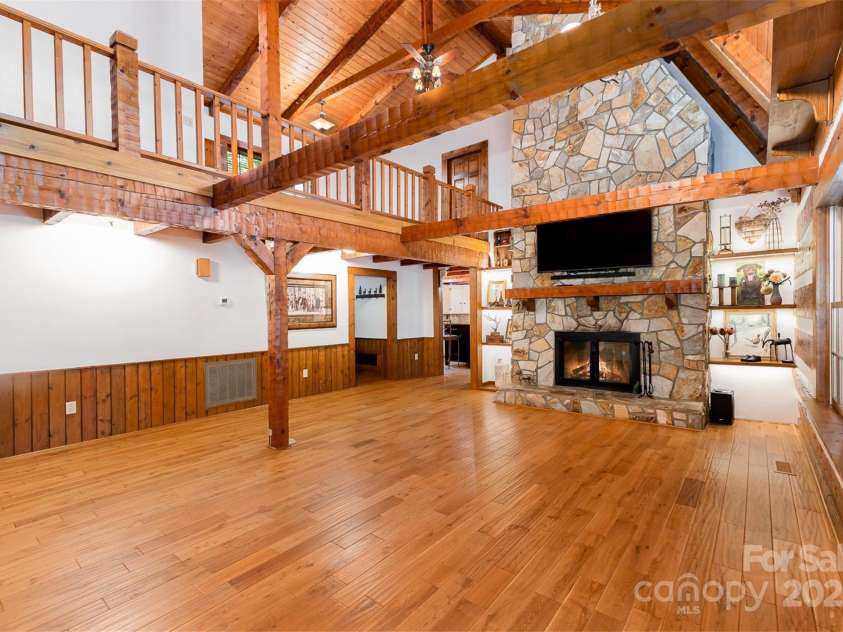 2709 Blythe Road, Waxhaw, NC 28173.  MLS# CAR4264770, YatesRealty ID 30075. Double sided stone fireplace with lighted built-ins.