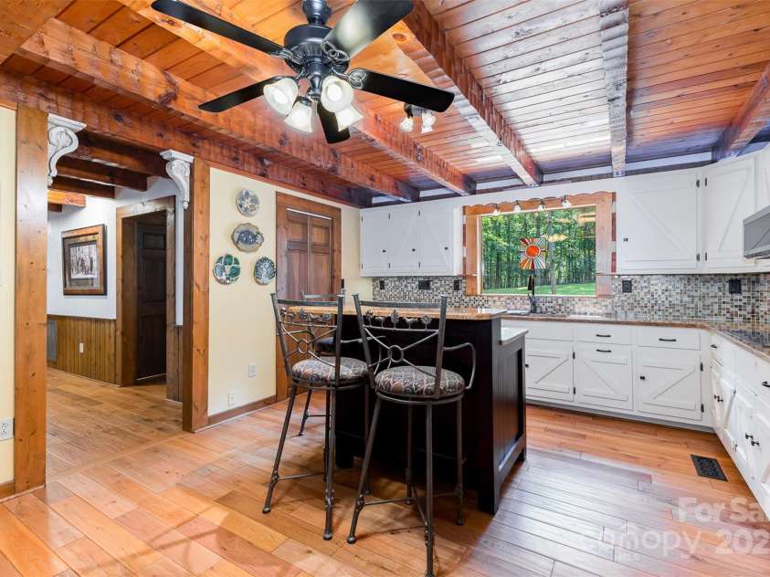 2709 Blythe Road, Waxhaw, NC 28173.  MLS# CAR4264770, YatesRealty ID 30075. Granite, tile backsplash and beautiful white cabinetry.