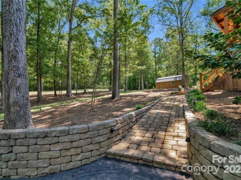2709 Blythe Road, Waxhaw, NC 28173.  MLS# CAR4264770, YatesRealty ID 30075. Sidewalk to backyard/sprawling porch.
