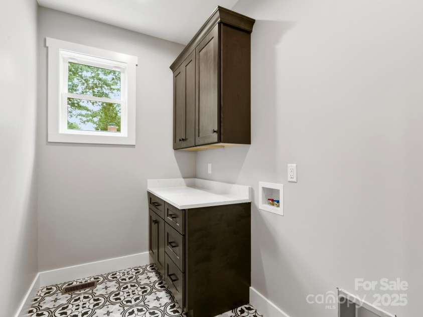 231 Asbury Road, Candler, NC 28715.  MLS# CAR4283786, YatesRealty ID 30077. Laundry Room