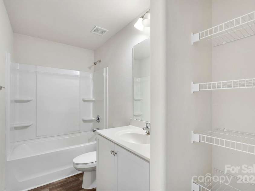 304 Ware Street, Kings Mountain, NC 28086.  MLS# CAR4282123, YatesRealty ID 30083. Hall bathroom with built in storage and modern vanity.