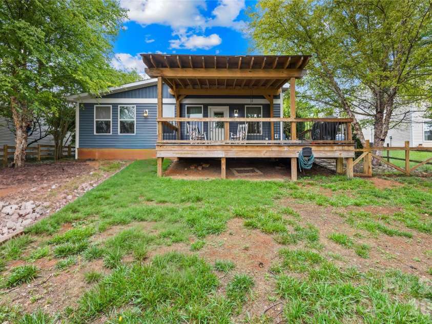 953 Rocky Meadows Lane, Concord, NC 28025.  MLS# CAR4384156, YatesRealty ID 30092. Back deck with view towards Rocky River