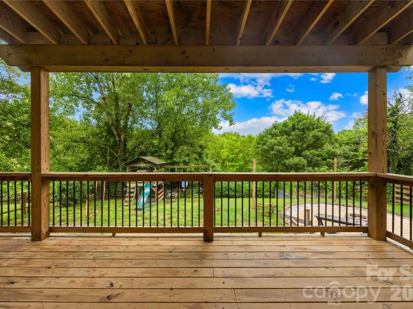 953 Rocky Meadows Lane, Concord, NC 28025.  MLS# CAR4384156, YatesRealty ID 30092. Covered back deck