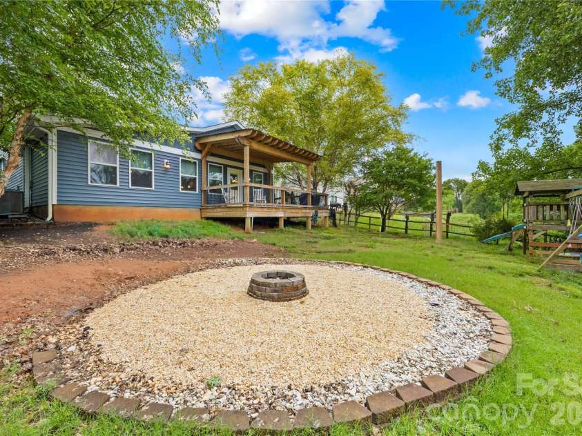 953 Rocky Meadows Lane, Concord, NC 28025.  MLS# CAR4384156, YatesRealty ID 30092. New firepit area