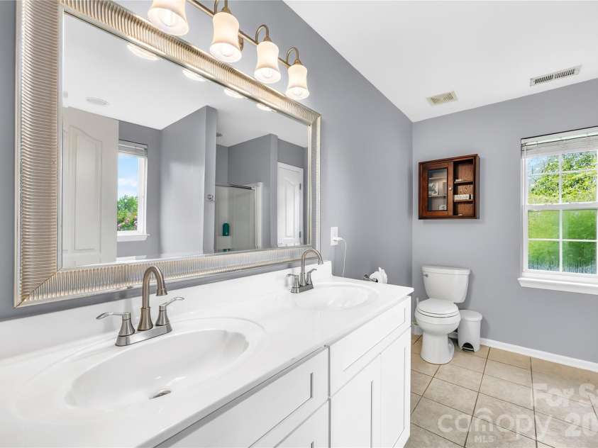 953 Rocky Meadows Lane, Concord, NC 28025.  MLS# CAR4384156, YatesRealty ID 30092. Primary bath with new double vanity