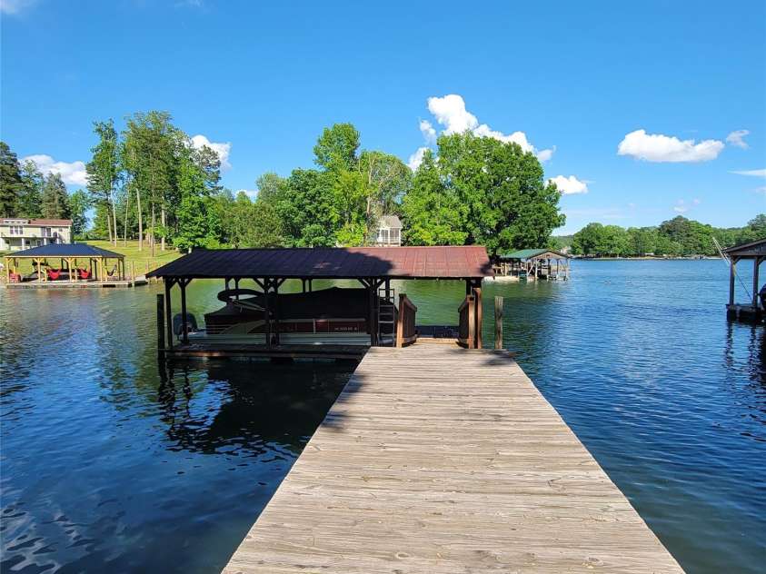 221 Stillwater Road, Troutman, NC 28166.  MLS# CAR4255773, YatesRealty ID 30097. Covered dock with DEEP WATER!