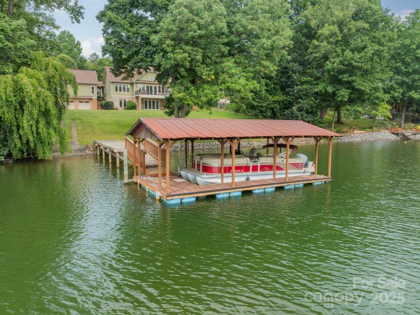 221 Stillwater Road, Troutman, NC 28166.  MLS# CAR4255773, YatesRealty ID 30097. Very nicely designed covered boat dock!  Duke Energy Lake Services permit confirmed.